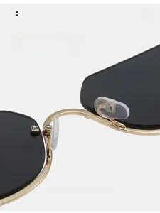 Macro detail of golden metal sunglasses frame with comfortable clear silicone nose pads