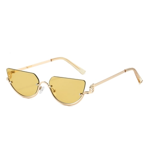 Modern cat eye sunglasses with gold metal frame and unique musical note temple design