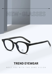 Detail of black oval glasses frame showing anti-blue light lens and metal core in temple