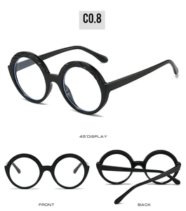 Three-angle view of round black oversized sunglasses with thick textured wavy frames