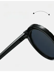 Detail of durable texture hinge and glossy black frame on stylish round sunglasses