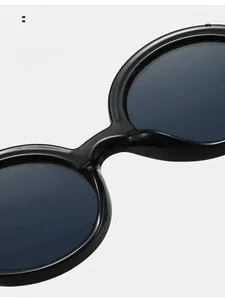 Detailed close-up of comfortable integrated nose pads on black round frame sunglasses