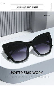 Detail of black cat-eye sunglasses featuring purple gradient lenses and premium frame