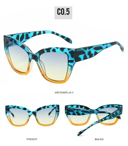 Detailed view of blue cat-eye sunglasses with animal print frames and gradient lenses