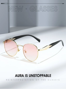 Detailed macro view of gold metal frames with pink gradient lenses and composite temples