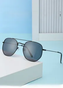 Close-up of trendy men's sunglasses featuring a retro double bridge and black metal frame