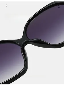 Close-up of comfortable integrated nose pads on black oval oversized sunglasses