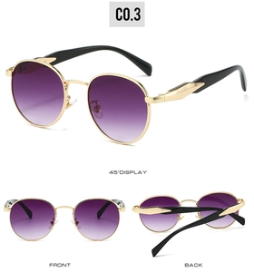 Detailed views of vintage oval sunglasses with gold metal frames and purple gradient lenses