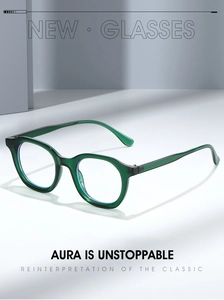 Gros plan sur la monture ovale vert foncé avec verres anti-lumière bleue et style rétro