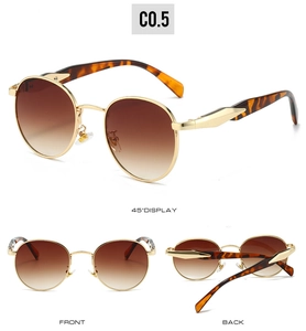 Detailed views of vintage oval metal sunglasses with gold frames and brown gradient lenses