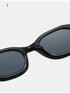 Macro detail of comfortable nose pads and sleek bridge on black oval sunglasses