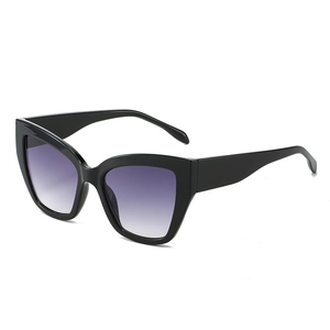 Retro cat-eye sunglasses with black frame and purple gradient lenses on white background