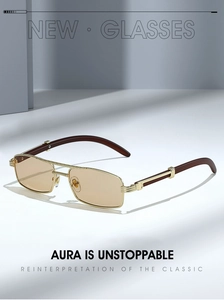 Detail of vintage small rectangular sunglasses with gold metal frame and wood grain temples