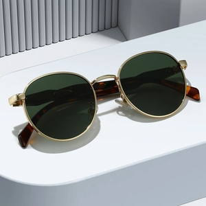 Retro oval metal sunglasses with gold frame and dark green lenses in 45-degree view