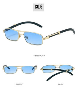Macro view of blue tint lenses and golden metal frame with elegant wood grain details