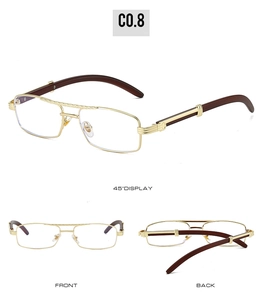 Detail view of gold metal frame sunglasses with wood grain temples and C-decor hinge design