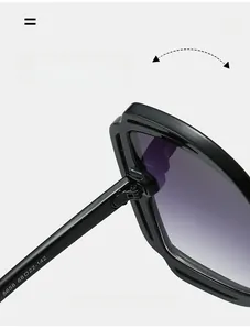 Detail view of reinforced metal hinge and purple gradient lens on large frame sunglasses