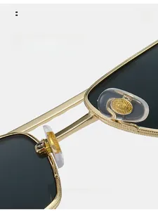 Macro view of gold metal sunglasses nose pads with transparent soft rubber detail