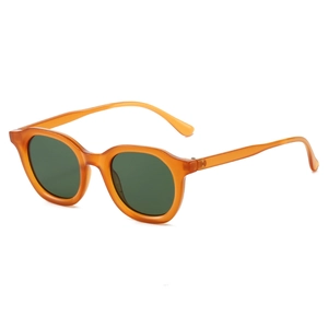 Vintage oval sunglasses with amber translucent frames and dark green lenses on white