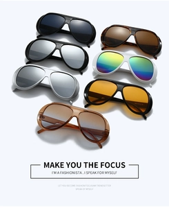 Flat lay array of colorful oversized aviator sunglasses with various lens finishes