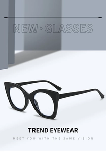 Macro shot of stylish black cat eye glasses featuring a glossy finish and blue light lens