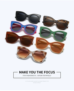 Collection of colorful cat-eye sunglasses in multiple patterns on a white backdrop