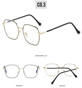 Detailed views of vintage large metal square glasses in gold and black finish