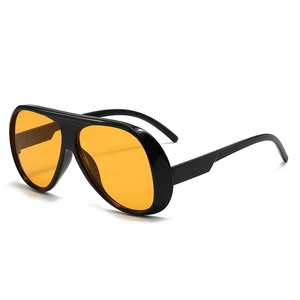 Retro aviator sunglasses with black frames and translucent orange lenses in white background