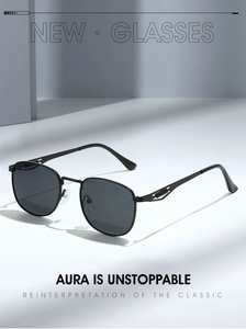Detail of retro metal sunglasses showing hollow spring temple design and grey lenses