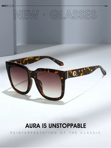 Detail of square tortoiseshell sunglasses with brown gradient lenses and metal accents