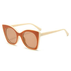 Retro cat-eye sunglasses with cream frames and brown lenses for a stylish summer look