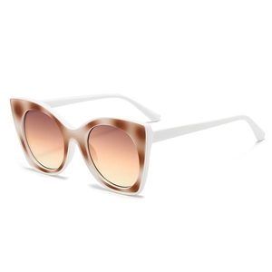 Fashion cat eye sunglasses with white frames and orange gradient lenses on white background