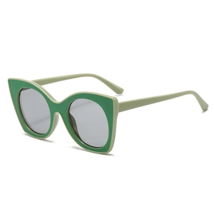 Chic cat eye sunglasses with light green frames and layered dark green lens accents