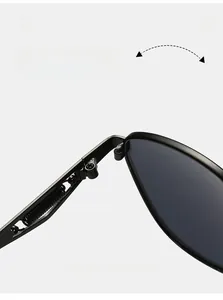 Macro view of durable metal hinge on retro sunglasses showing flexible spring structure