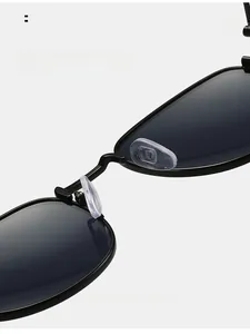 Macro shot of comfortable silicone nose pads on retro black metal sunglasses frames