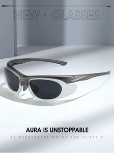 Detail of Y2K sporty sunglasses with dark grey streamlined frame and translucent side wings