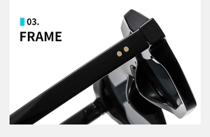 Close-up of black glossy sunglasses frame with gold rivet details on high-quality acetate