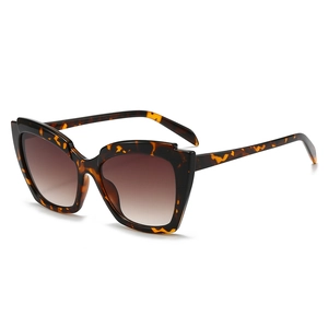 Retro cat-eye sunglasses with tortoiseshell frames and brown gradient lenses