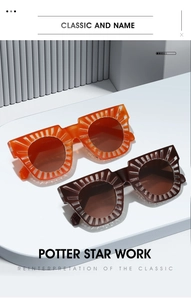 Detail of square oversized sunglasses with unique sunburst texture on orange and red frames