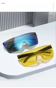Detail of blue mirrored and yellow transparent rimless cycling sunglasses on a white pedestal