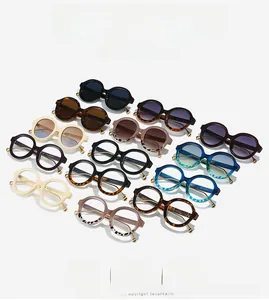 Detailed view of various retro round sunglasses frames with golden metal hinges
