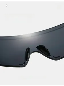 Detail of comfortable nose pads on frameless cycling sunglasses with grey lenses