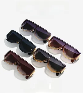 Flat lay of rimless shield sunglasses with rivet details and wide temples in multiple colors
