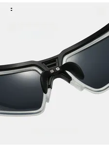 Detail of soft anti-slip silicone nose pads on black and white cycling sunglasses
