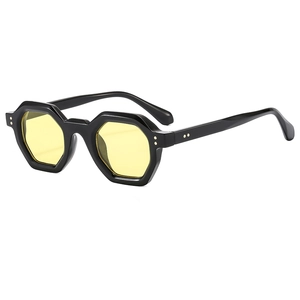 Fashionable hexagonal black frame sunglasses with yellow lenses and metal rivets detail