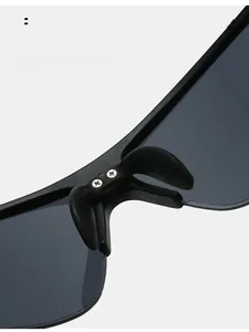 Detail of comfortable silicone nose pads with metal screw fixings for sports sunglasses
