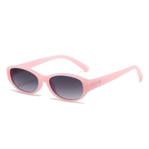Stylish pink matte oval sunglasses with grey gradient lenses for women in retro street style