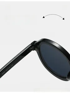 Close-up of durable metal hinges and specification code on black oval sunglasses