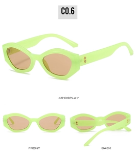Vue détaillée des lunettes de soleil œil-de-chat vert fluo avec branches serties