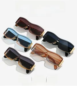 Detail view showing assorted rimless oversized sunglasses in multiple colors and golden frames